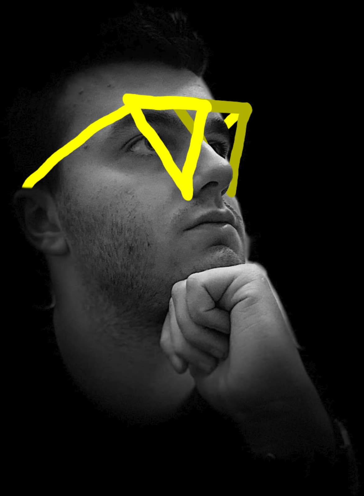 A portrait of Victor with a pair of cartoon glasses drawn in the shape of two V's over his eyes